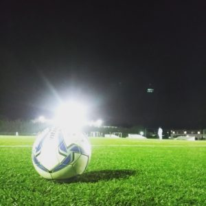 サッカーボールとスタジアム